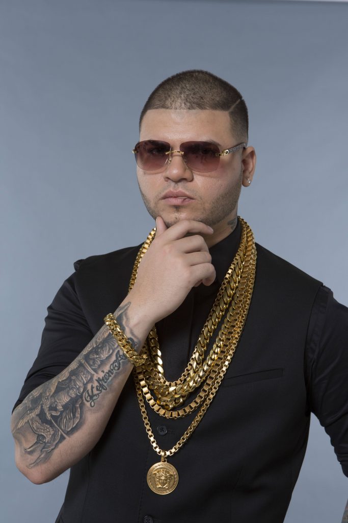 Farruko portrait high resolution stylish black shirt gold chains Versace pendant sunglasses tattoos Wallpaper