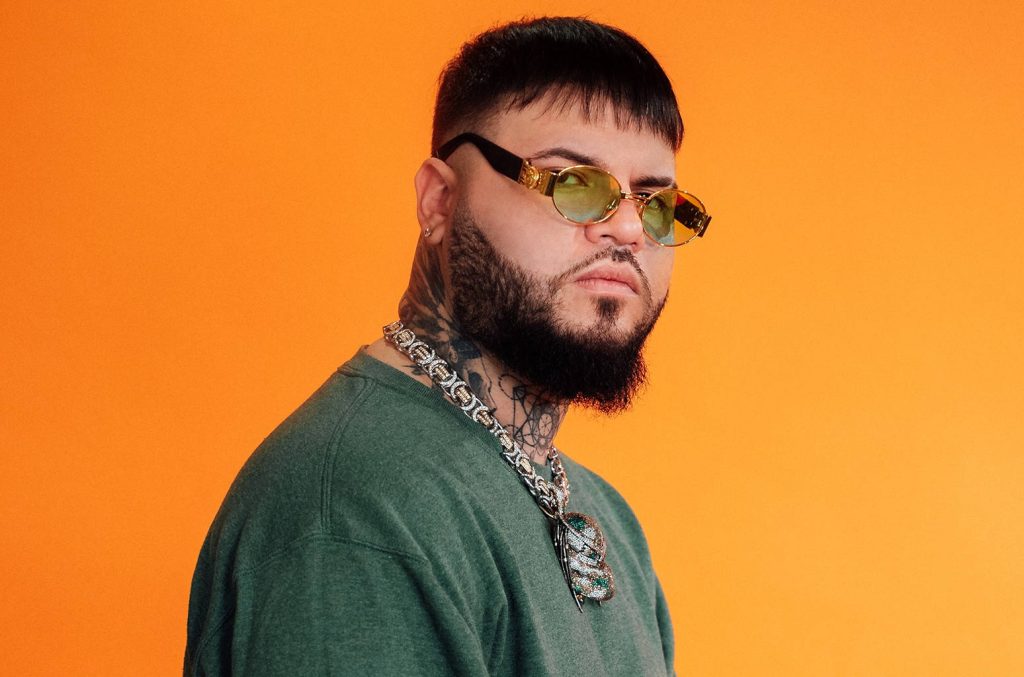 Farruko portrait wallpaper green shirt sunglasses silver chain orange background high resolution