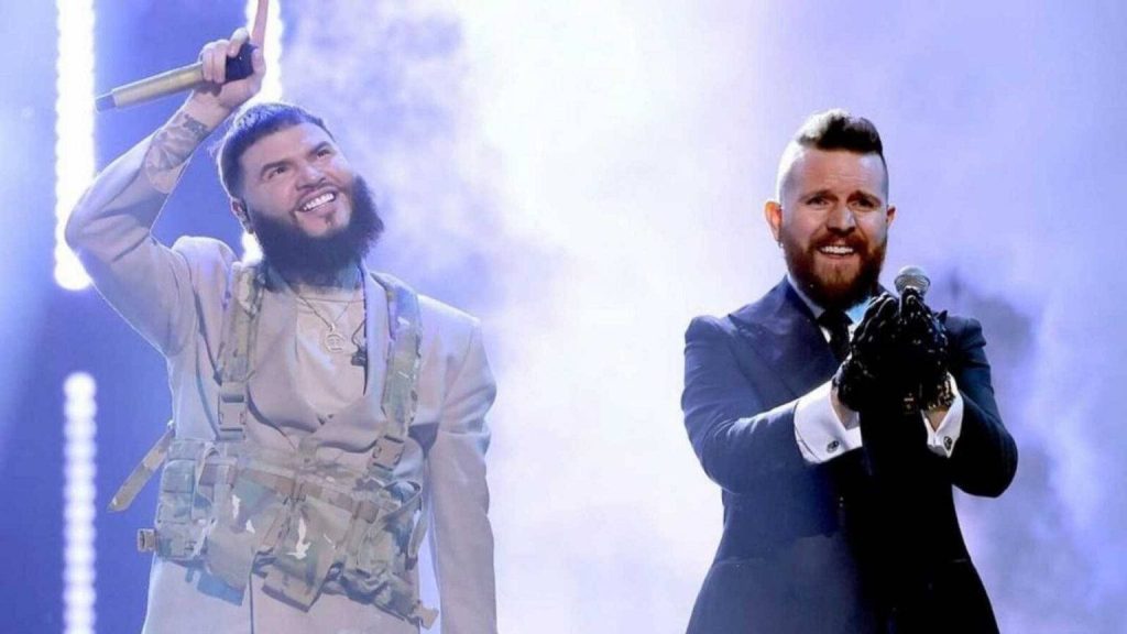 Farruko and Pedro Capó performing live on stage in smoky lighting vibrant Latin music concert wallpaper