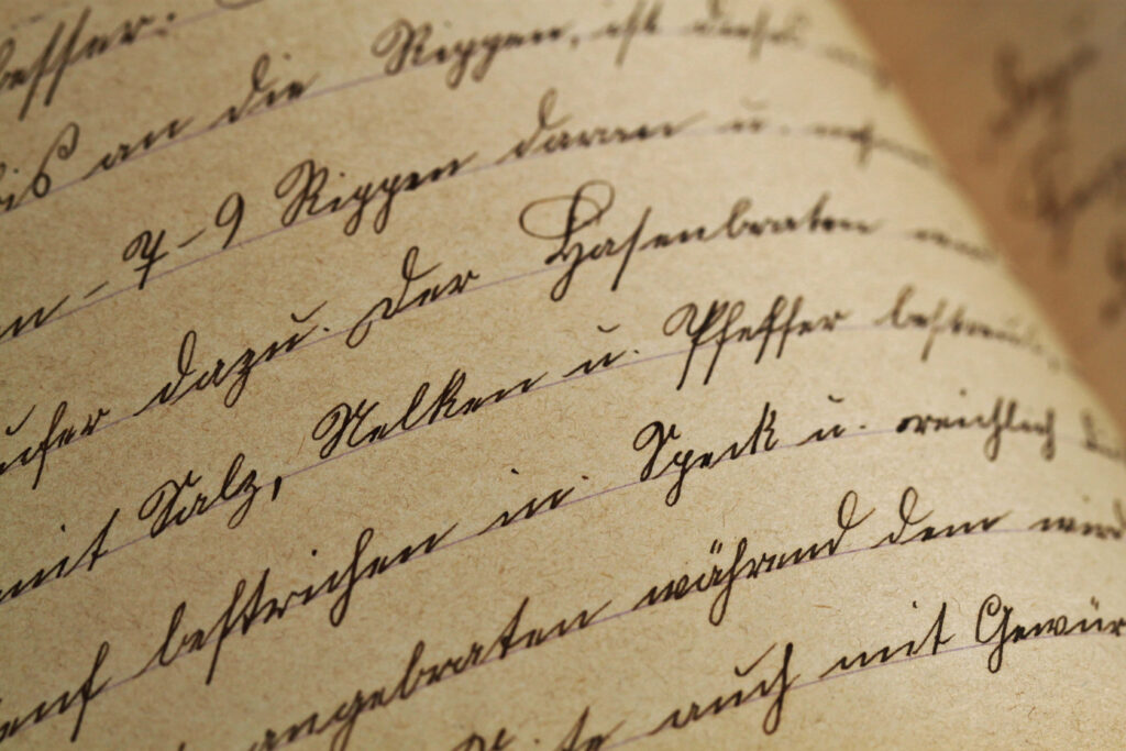 Delving into the Timeworn Script: Captivating Details of Vintage Handwriting on Aged Paper Wallpaper