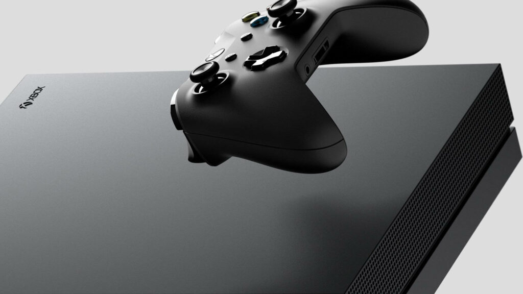 Gaming Magic: The Majestic Xbox One X and Controller Soaring in the Shadows Wallpaper