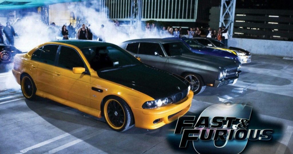 Fast and Furious 6 HD wallpaper with sleek customized cars in vibrant urban action setting