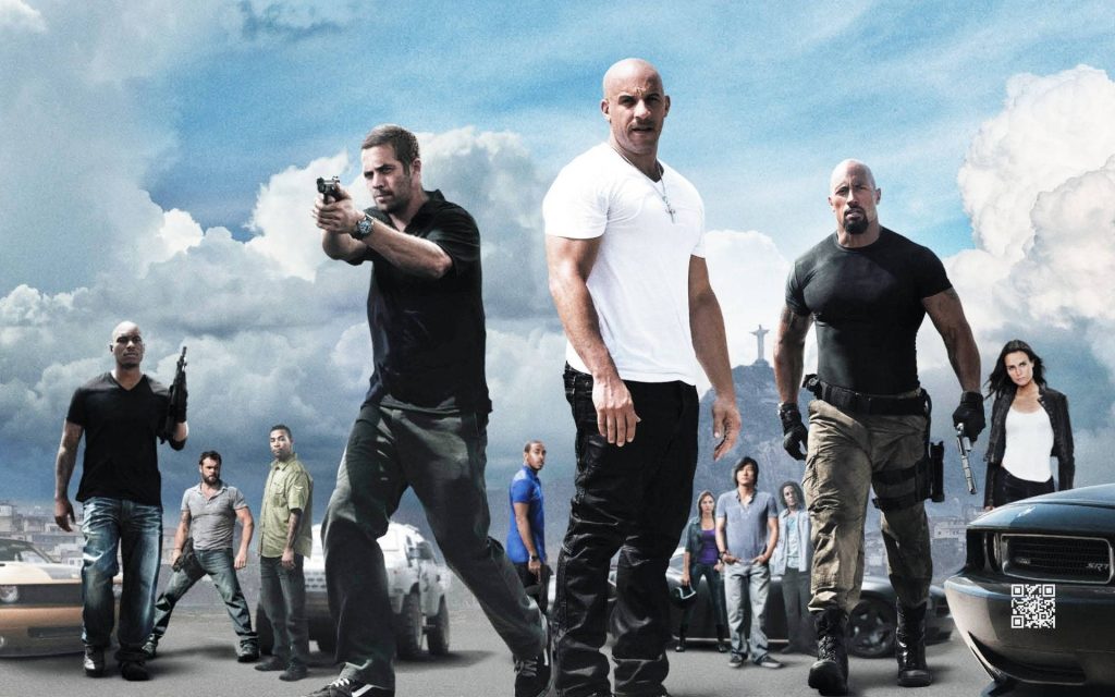 Fast Five wallpaper featuring Vin Diesel Paul Walker Dwayne Johnson with Rio de Janeiro skyline