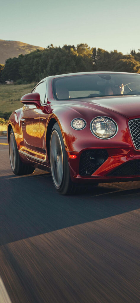Speeding into Luxury: A Red Bentley Continental Captured in an iPhone Wallpaper