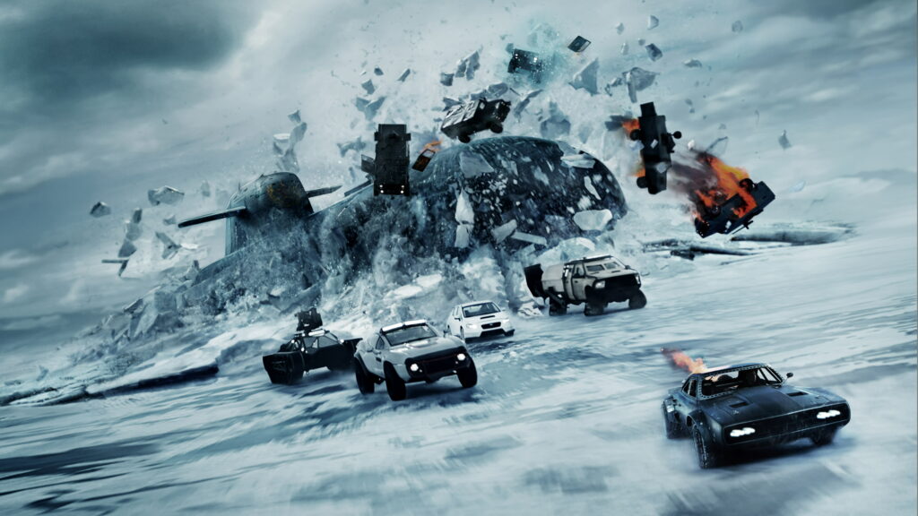 Fast and Furious 8: The Fate of the Furious 8K Wallpaper: High-Octane Chase Scene on Frosty Terrain with Explosive Backdrop in UHD 8K 7680x4320 Resolution
