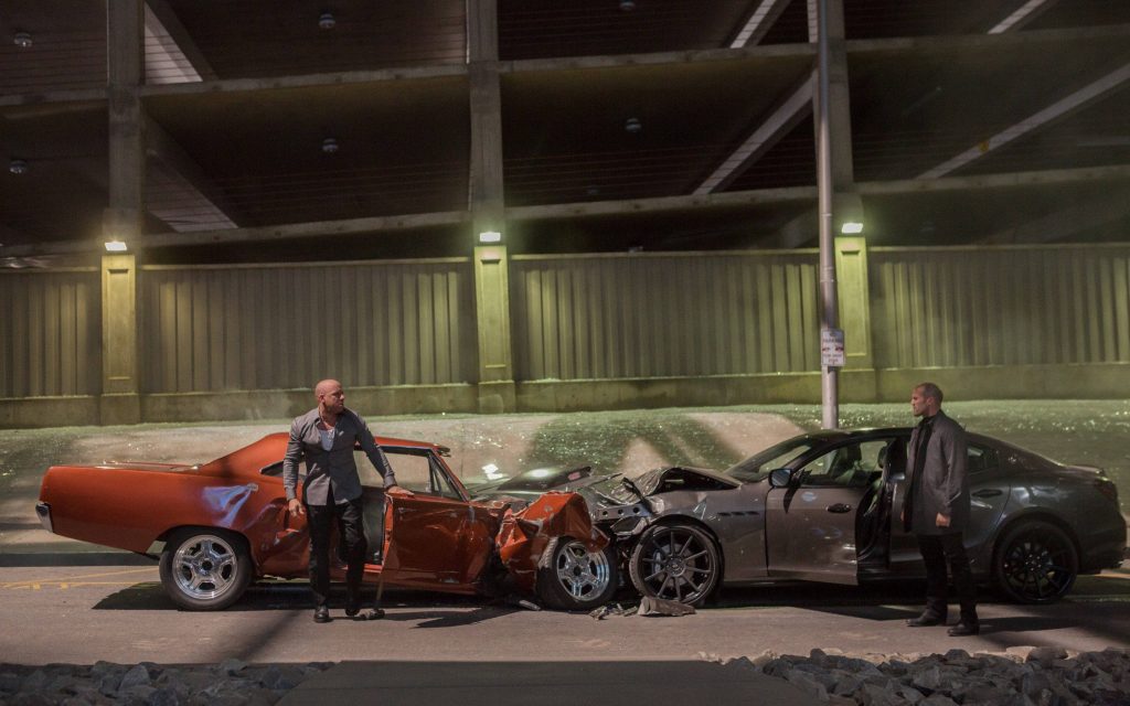 Dom Toretto and Deckard Shaw intense standoff in parking garage Fast and Furious wallpaper