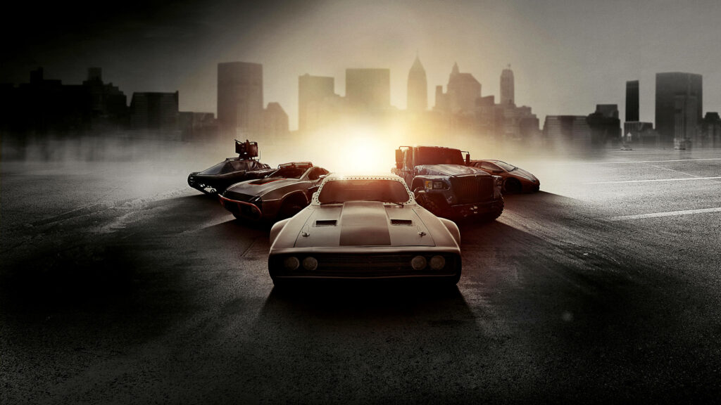 Fast and Furious iconic cars lineup with city skyline at sunset urban wallpaper background