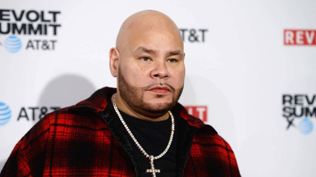 High-resolution portrait of rapper Fat Joe in red plaid jacket with diamond chain at Revolt Summit Wallpaper