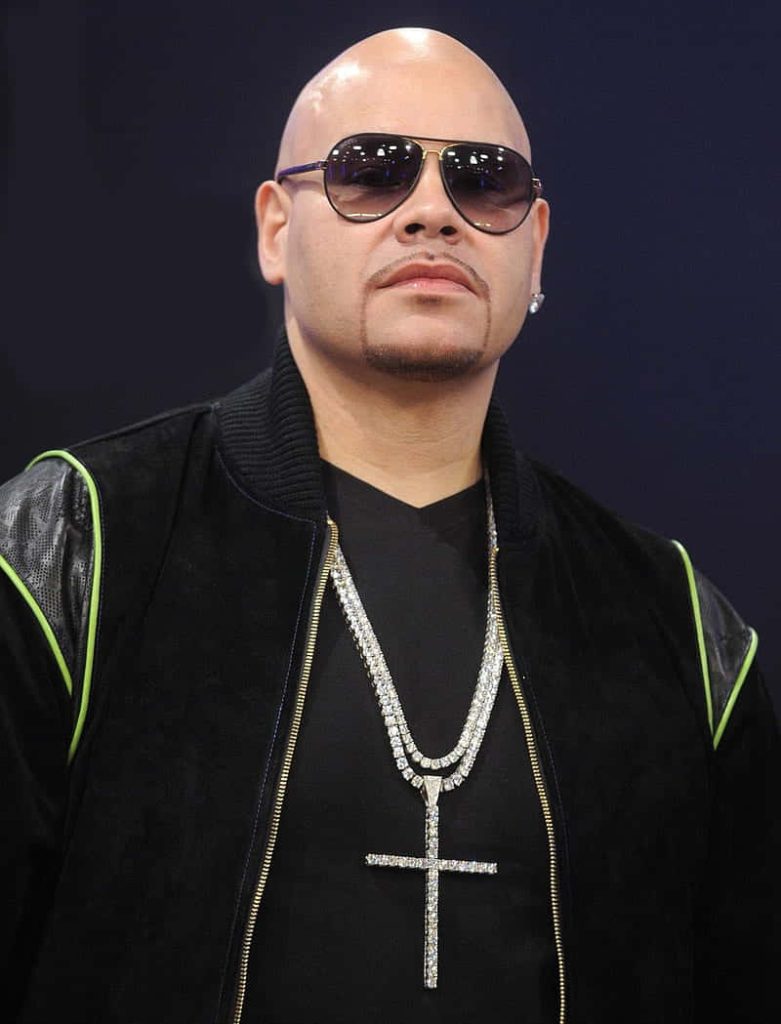 Sharp portrait of rapper Fat Joe in black lime green jacket sunglasses iced out cross necklace Wallpaper