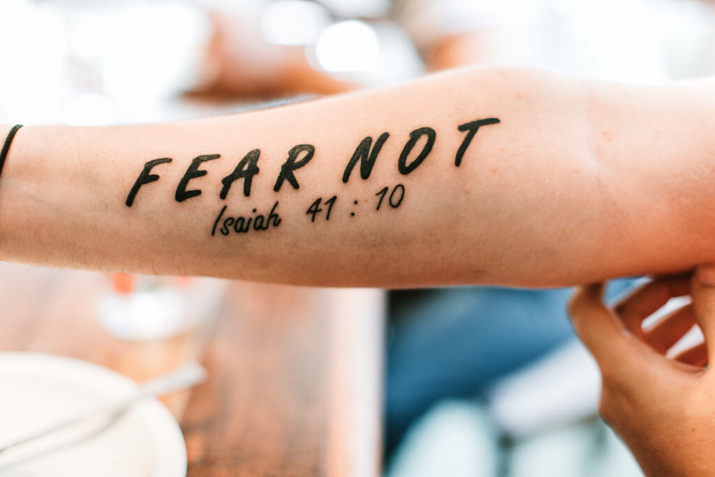 Close-Up Forearm Tattoo: 'FEAR NOT' Isaiah 41:10 Wallpaper