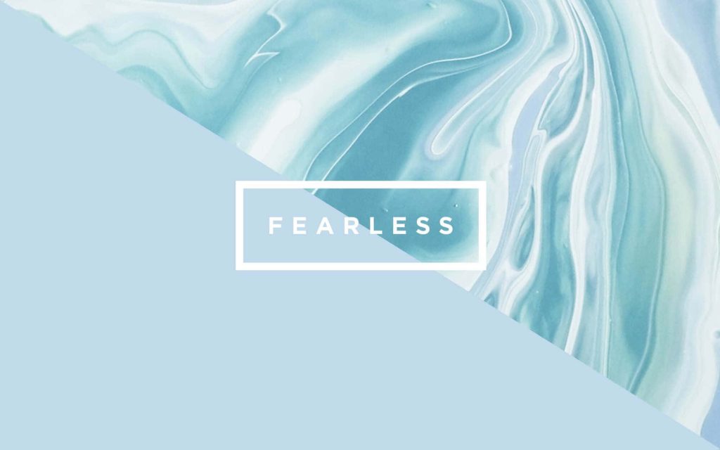 Blue marble laptop wallpaper with pastel and swirling textures and fearless motivational text