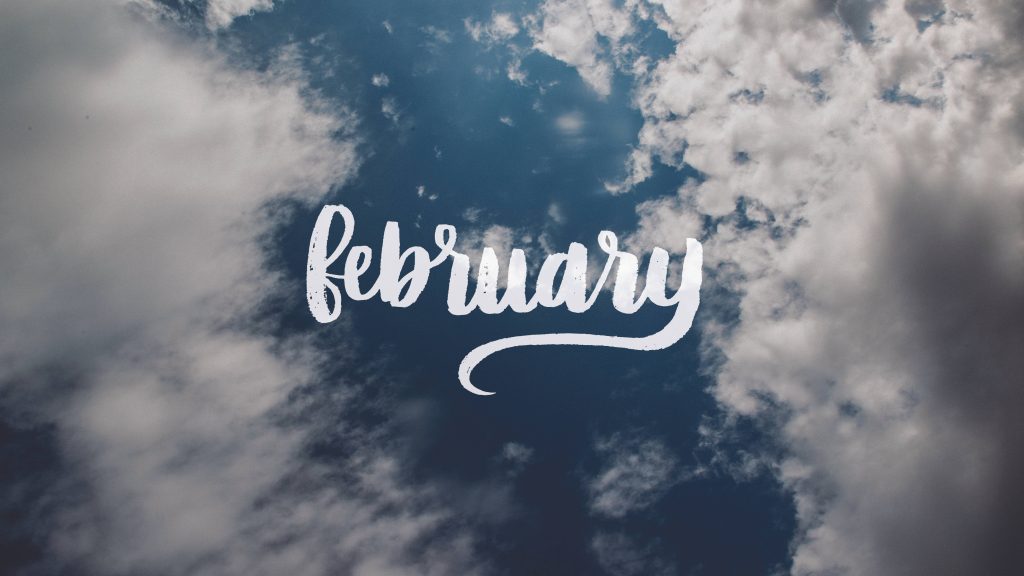 February wallpaper with white script text on deep blue sky and fluffy clouds background