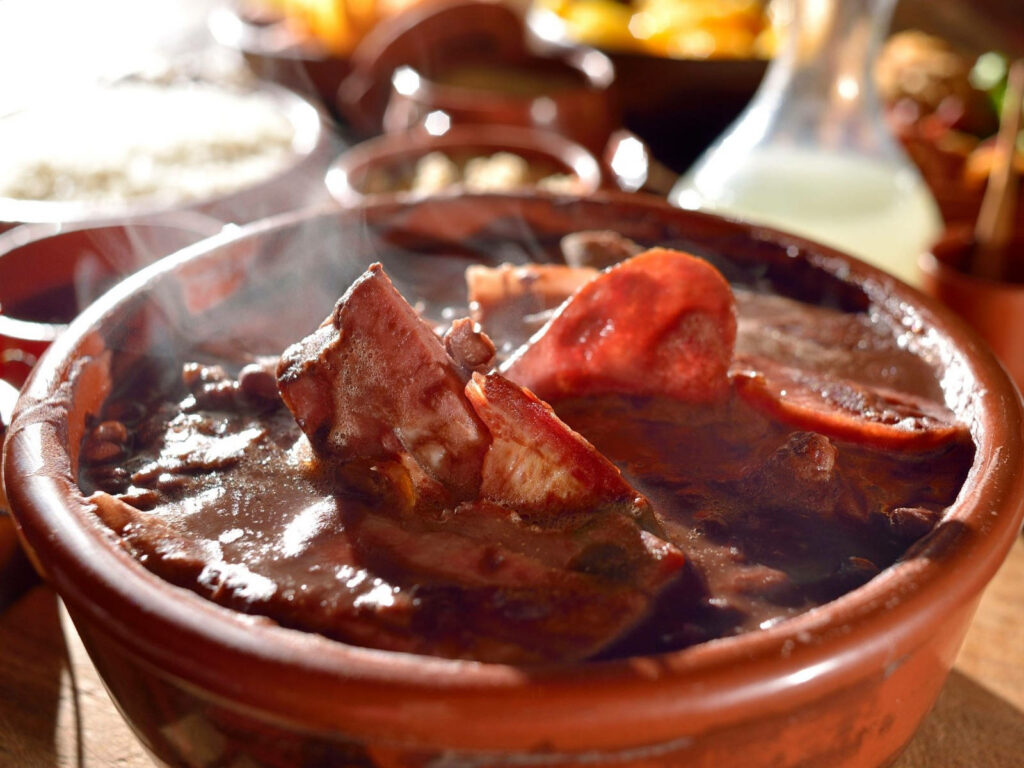 Feijoada in Clay Pot: Hearty Brazilian Dish Wallpaper Background