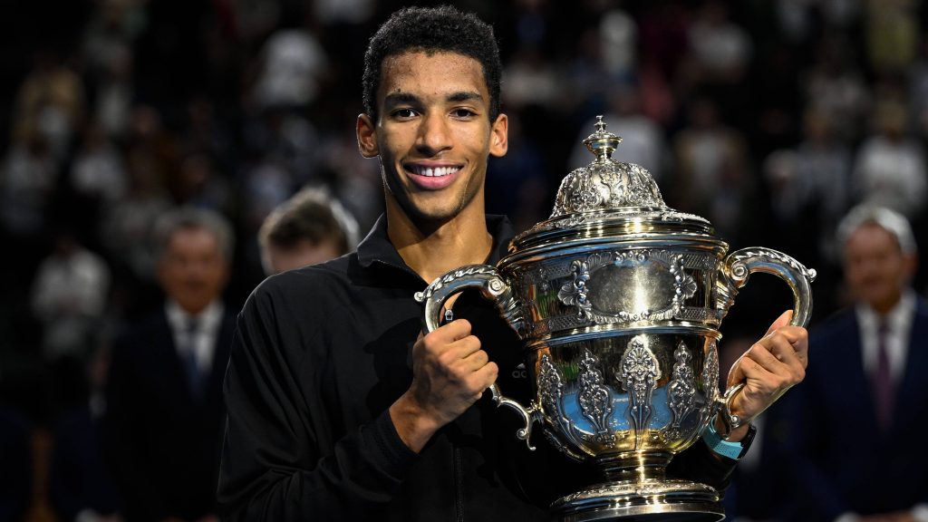 Felix Auger-Aliassime celebrating with Davis Cup trophy high resolution sports wallpaper background