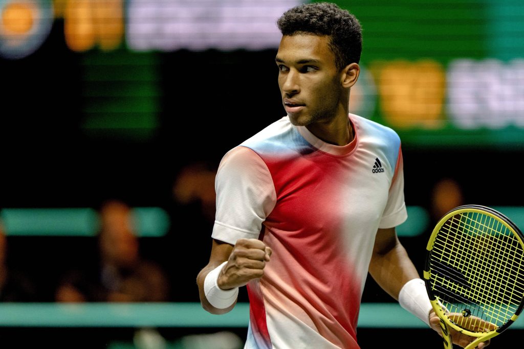 Félix Auger-Aliassime intense tennis celebration fist pump Adidas shirt yellow racket wallpaper
