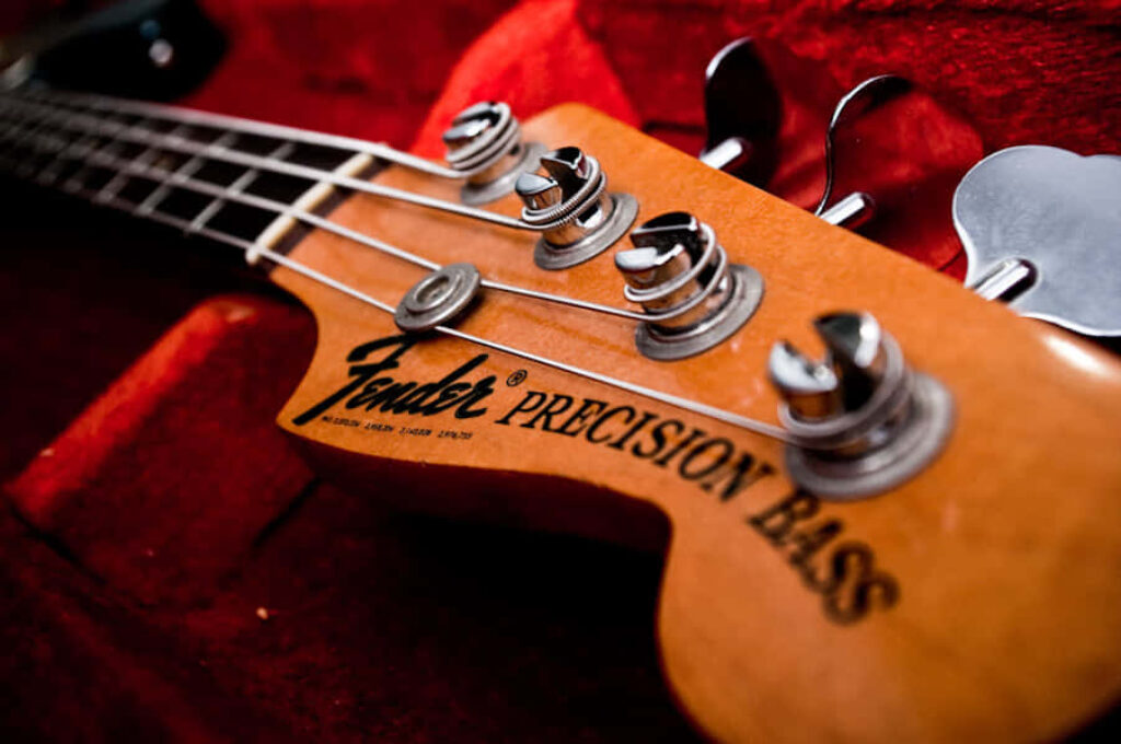 Stunning Fender Precision Bass Wallpaper with Red Background