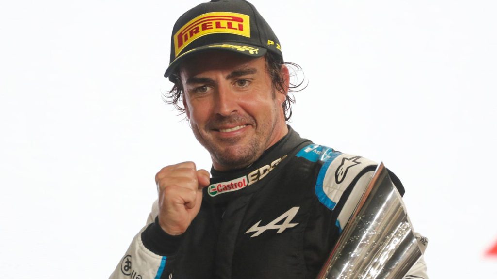 Fernando Alonso celebrates podium finish in Alpine F1 racing gear bright sports wallpaper