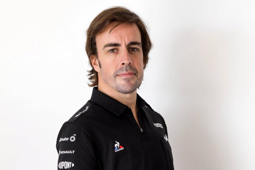 Fernando Alonso Alpine F1 Team portrait with Renault logos black polo white background wallpaper