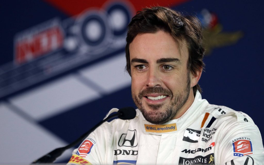 Fernando Alonso in white McLaren Andretti suit smiling Indy 500 wallpaper high-resolution portrait
