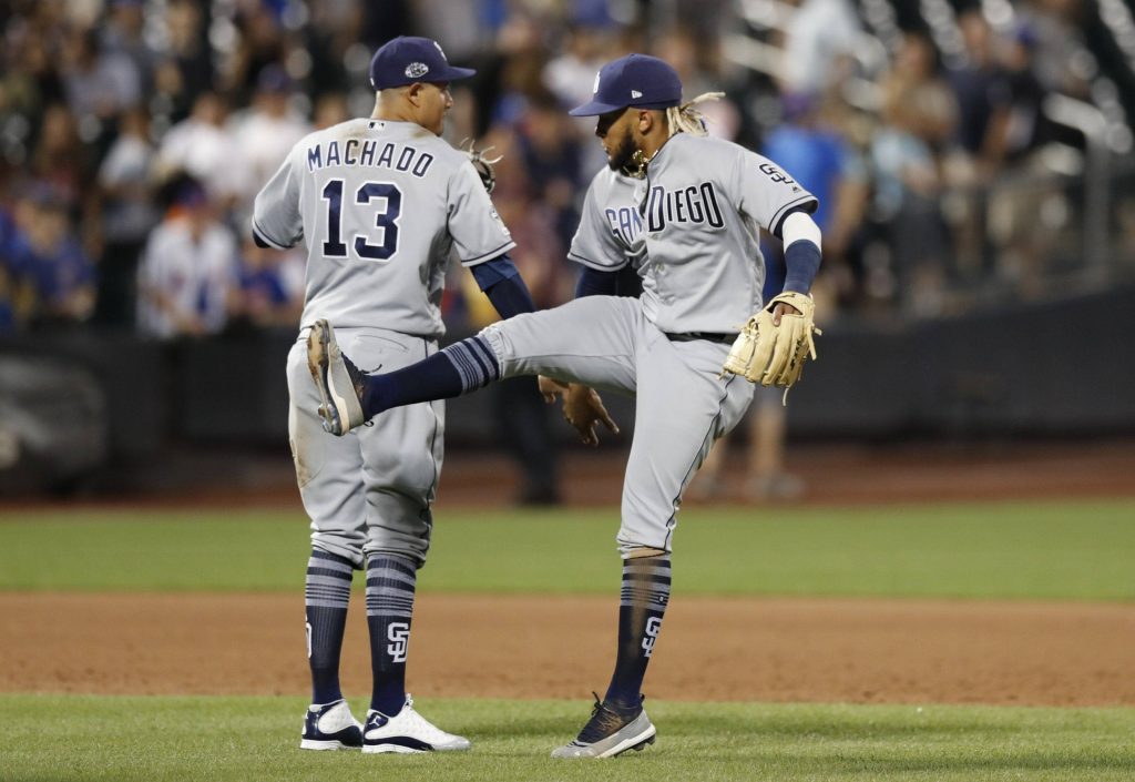 Fernando Tatis Jr and Manny Machado Padres wallpaper action shot in gray jerseys stadium lights
