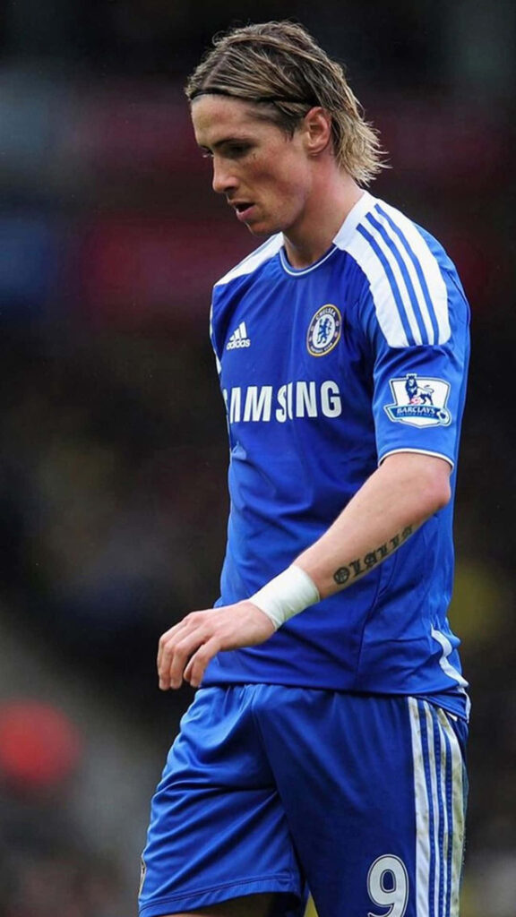 Fernando Torres in Chelsea kit striking a football dynamic wallpaper for soccer fans background