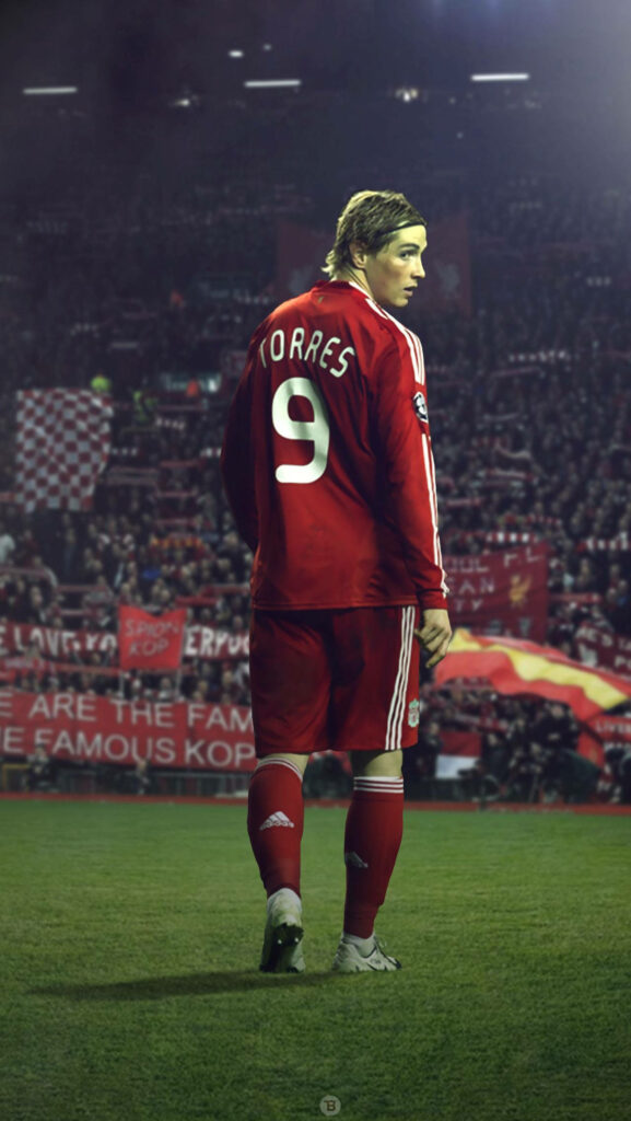 Fernando Torres Liverpool kit looking back on pitch with passionate crowd and banners background Wallpaper