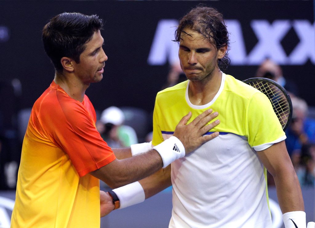 Fernando Verdasco consoles exhausted Rafael Nadal in intense tennis match moment wallpaper background