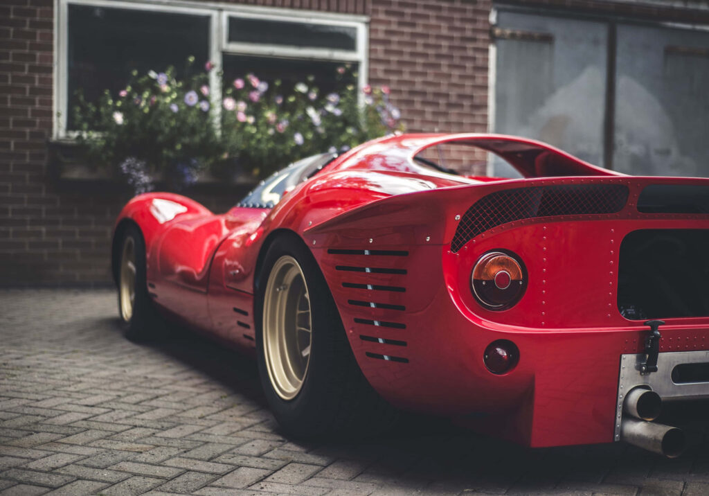 Captivating Automotive Art: Striking Rear View of Ferrari 330 P4 Model with Exquisite Aerodynamic Spoiler Wallpaper