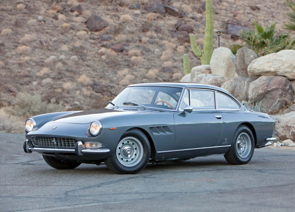 Vintage Elegance: Embracing Solitude with the Majestic Ferrari 330 on an Empty Road Wallpaper