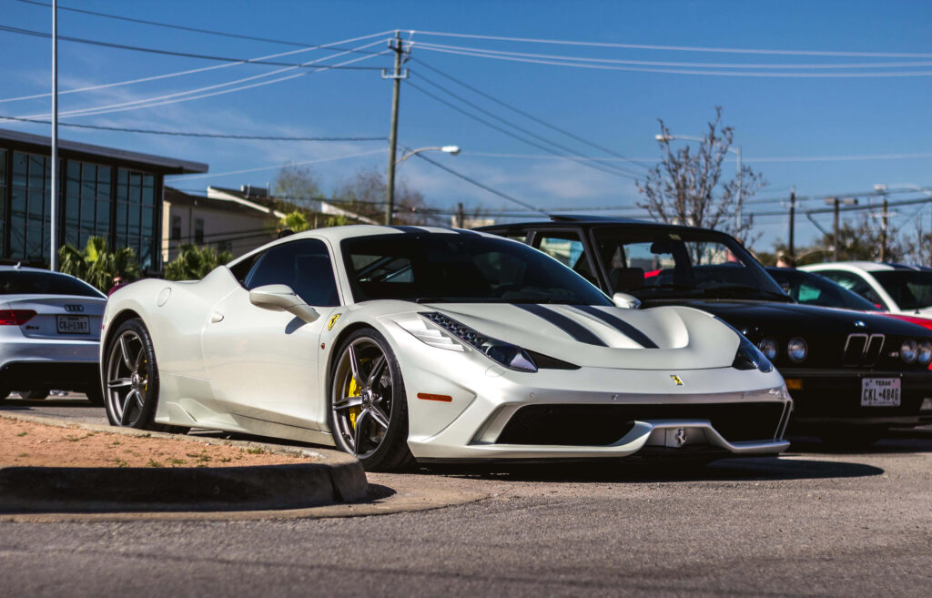 Unleashing the Italian Stallion: A Dazzling White Ferrari 458 Speciale Dominates the Street with its Racing Stripes and Luxurious Finesse Wallpaper