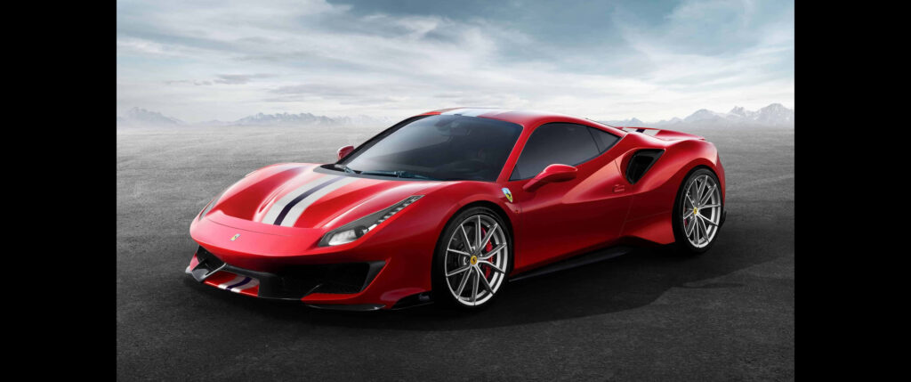 Red Ferrari 488 GTB on asphalt showcasing sleek design aerodynamic curves and racing stripes Wallpaper
