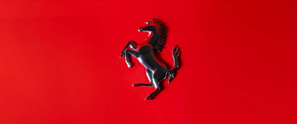 Ferrari: A Captivating Emblem in Fiery Red Wallpaper