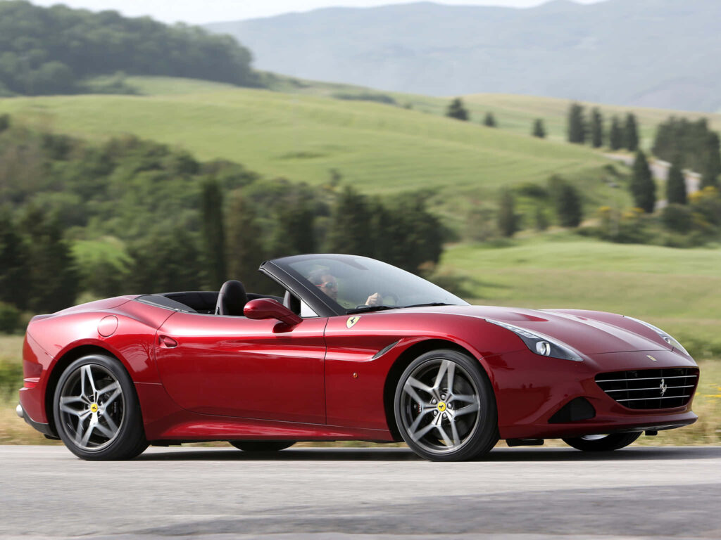 The Epitome of Elegance and Power: Unveiling the Dynamic Majesty of the Ferrari California T in a Breathtaking Scenic Journey Wallpaper