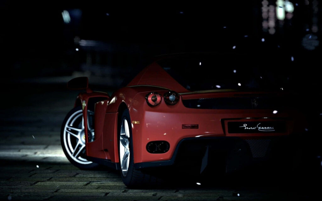 Ferrari Enzo: Capturing the Essence of Speed and Luxury on Scenic Asphalt Wallpaper