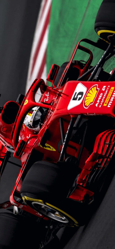 Diagonal view of Ferrari F1 2018 car racing fast on track vibrant Formula 1 wallpaper background