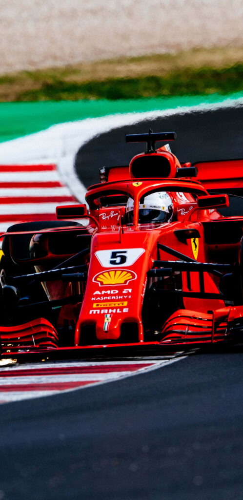 Ferrari F1 2018 car speeding on track showcasing Formula 1 racing precision and energy wallpaper