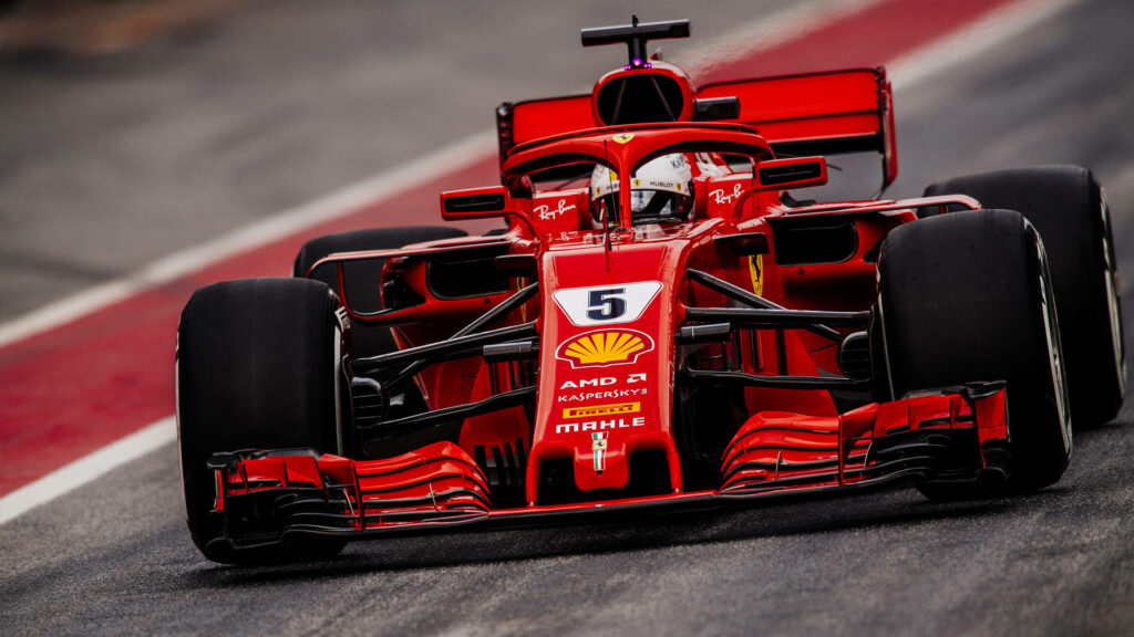 Intense Action: Speeding Ferrari F1 2018 Driven by a Masked F1 Pilot - Captivating Background Capture Wallpaper