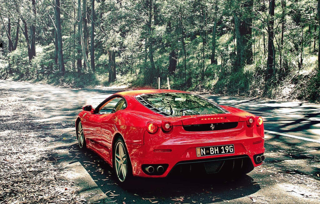 Ferrari F430: Unleashing the Thrill of Ultimate Speed on Endless Horizons Wallpaper
