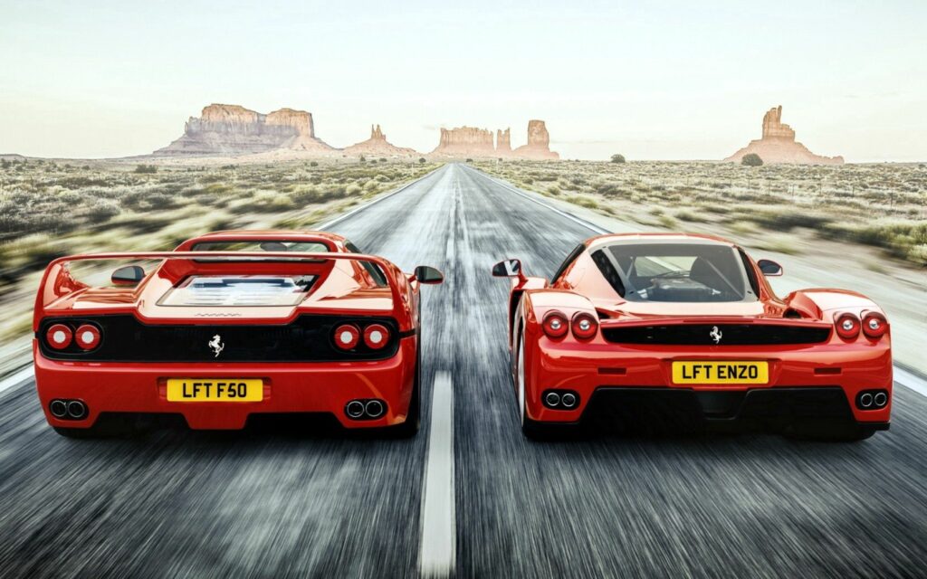 Ferrari F50 & Enzo: High-Speed Luxury Wallpaper in Desert Landscape