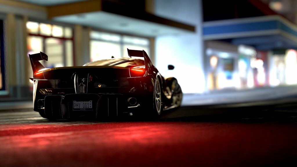 Ferrari FXX-K Rear View: Sleek Design & Urban Backdrop Wallpaper