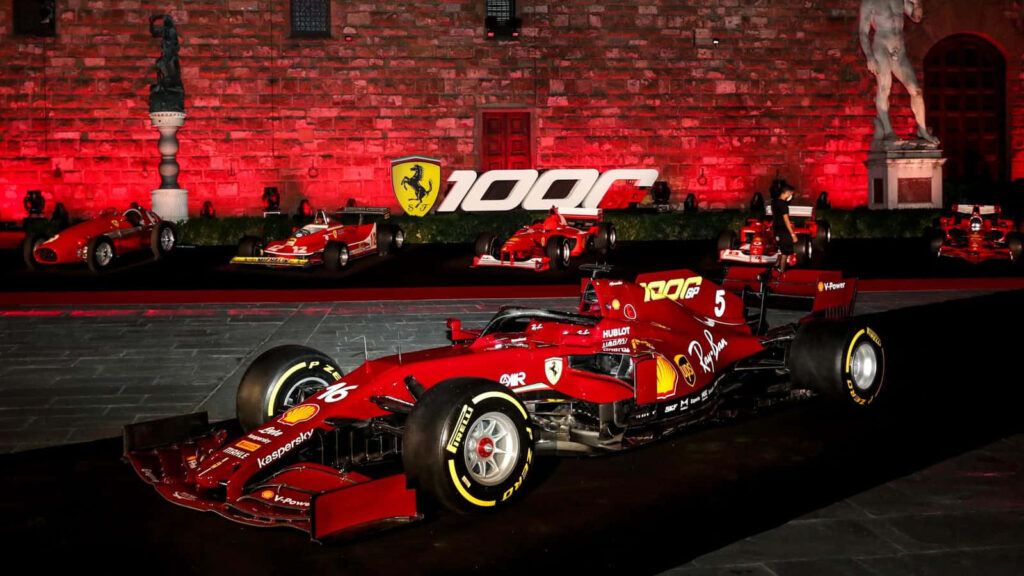 The Thunderous Velocity of Ferrari's Cutting-Edge Formula 1 Racer: Igniting Speed Records with its Dazzling Red and Silver Fusion Wallpaper