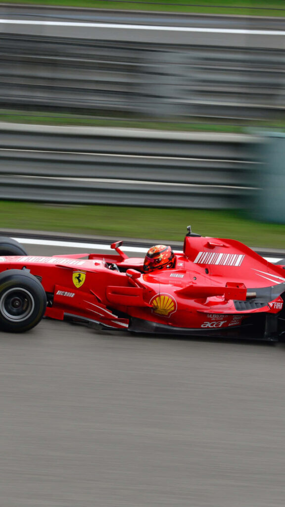 Speed and Precision: The Iconic Ferrari Formula 1 Racing Car Unleashed Wallpaper