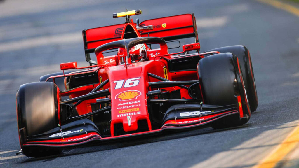 Ferrari Unleashed: Introducing the Cutting-Edge Formula One Racer at a Glamorous European Trade Show Wallpaper