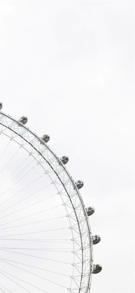 Captivating Monochrome Snapshot: White Sky Frames Half a Ferris Wheel in Stunning iPhone Photograph Wallpaper