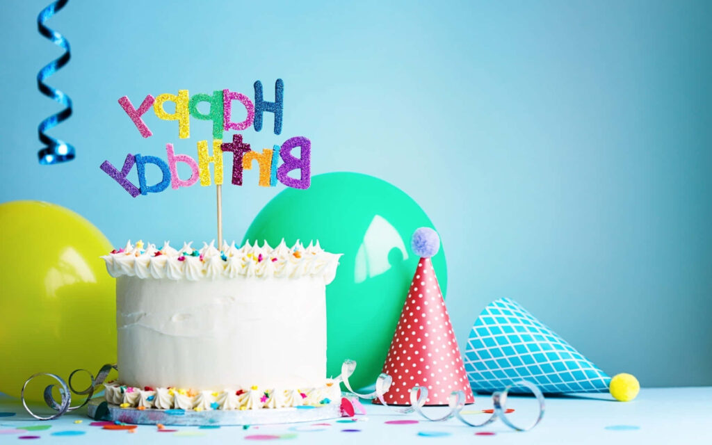Vibrant Birthday Cake Scene with Balloons and Confetti Decor Wallpaper