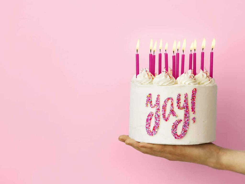 Festive Pink Birthday Cake Wallpaper with Sparkly 'Yay' Decor