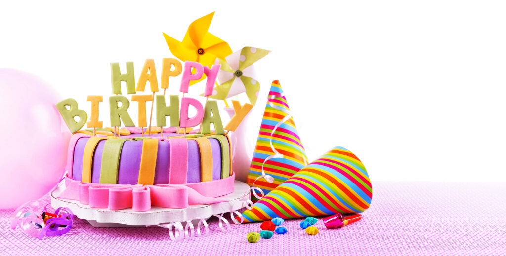 Festive Birthday Scene: Colorful Cake & Cheerful Party Decor Wallpaper