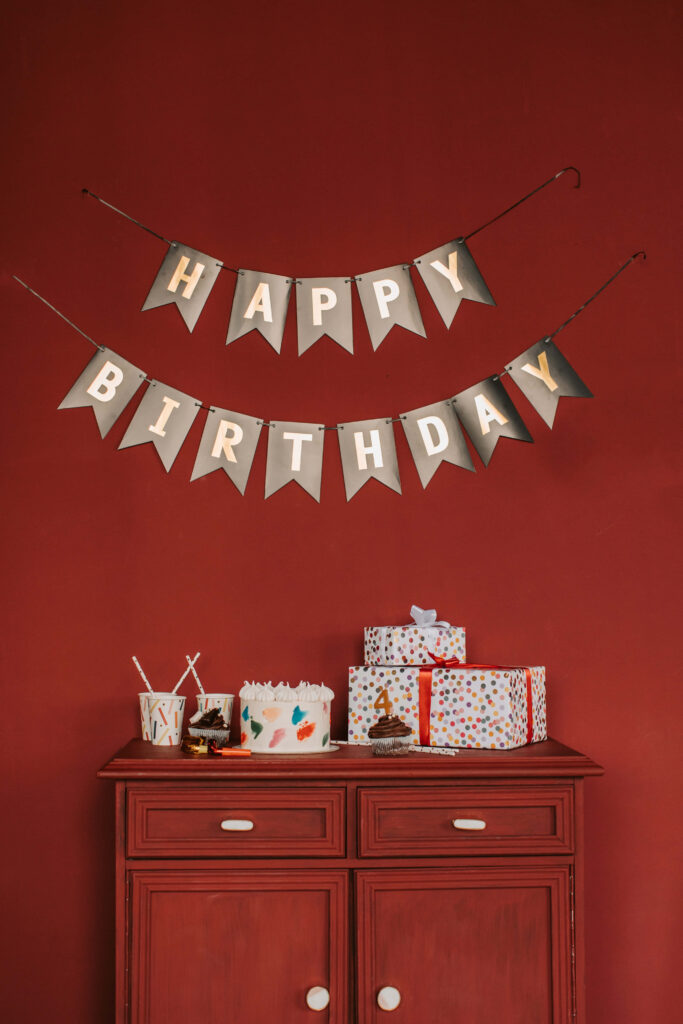 Festive Happy Birthday Wallpaper with Gifts & Cheerful Decor