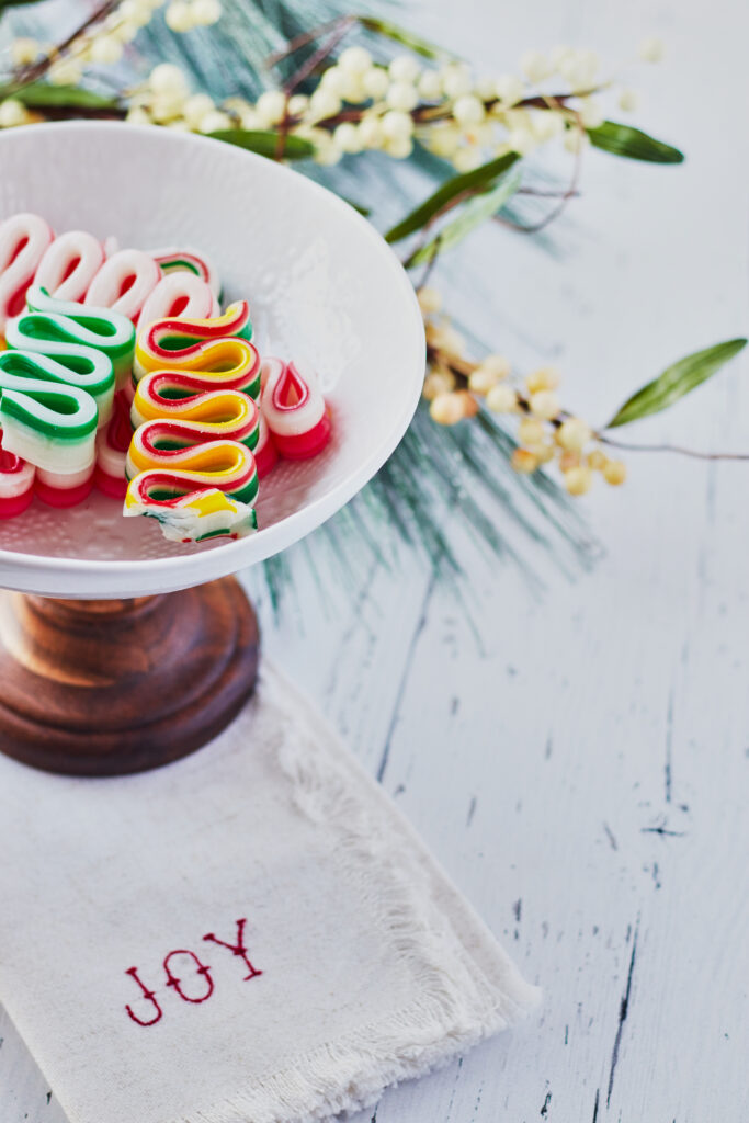 Festive Candy Ribbons on Decorative Stand - Cheerful Holiday Background Wallpaper