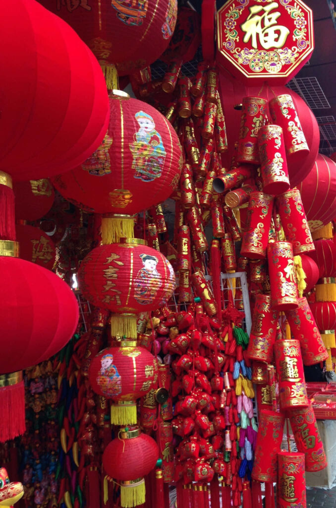 Festive Chinese New Year wallpaper with traditional red lanterns and colorful decorations